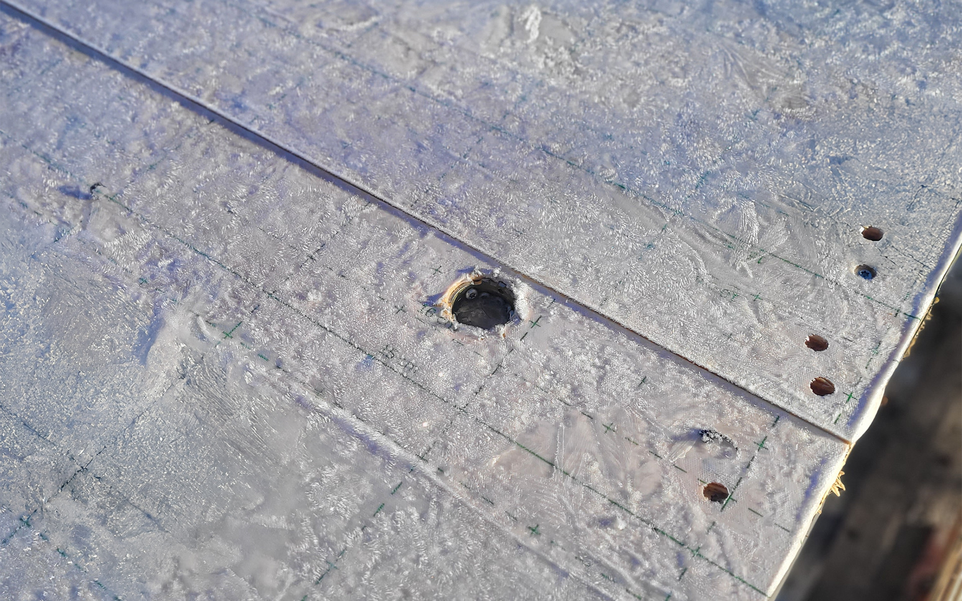 CLT panels protected with self-adhesive membrane during transport and construction phase