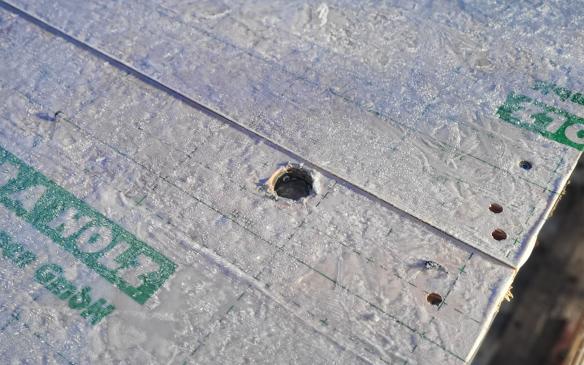 CLT panels protected with self-adhesive membrane during transport and construction phase