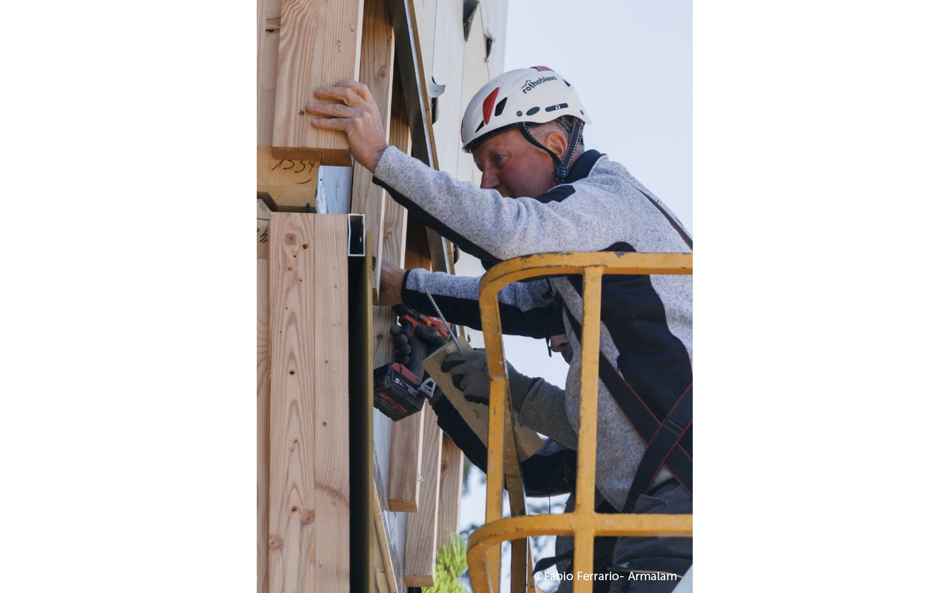 Installation of prefabricated timber facade with mechanical connections during off-site retrofit on existing building
