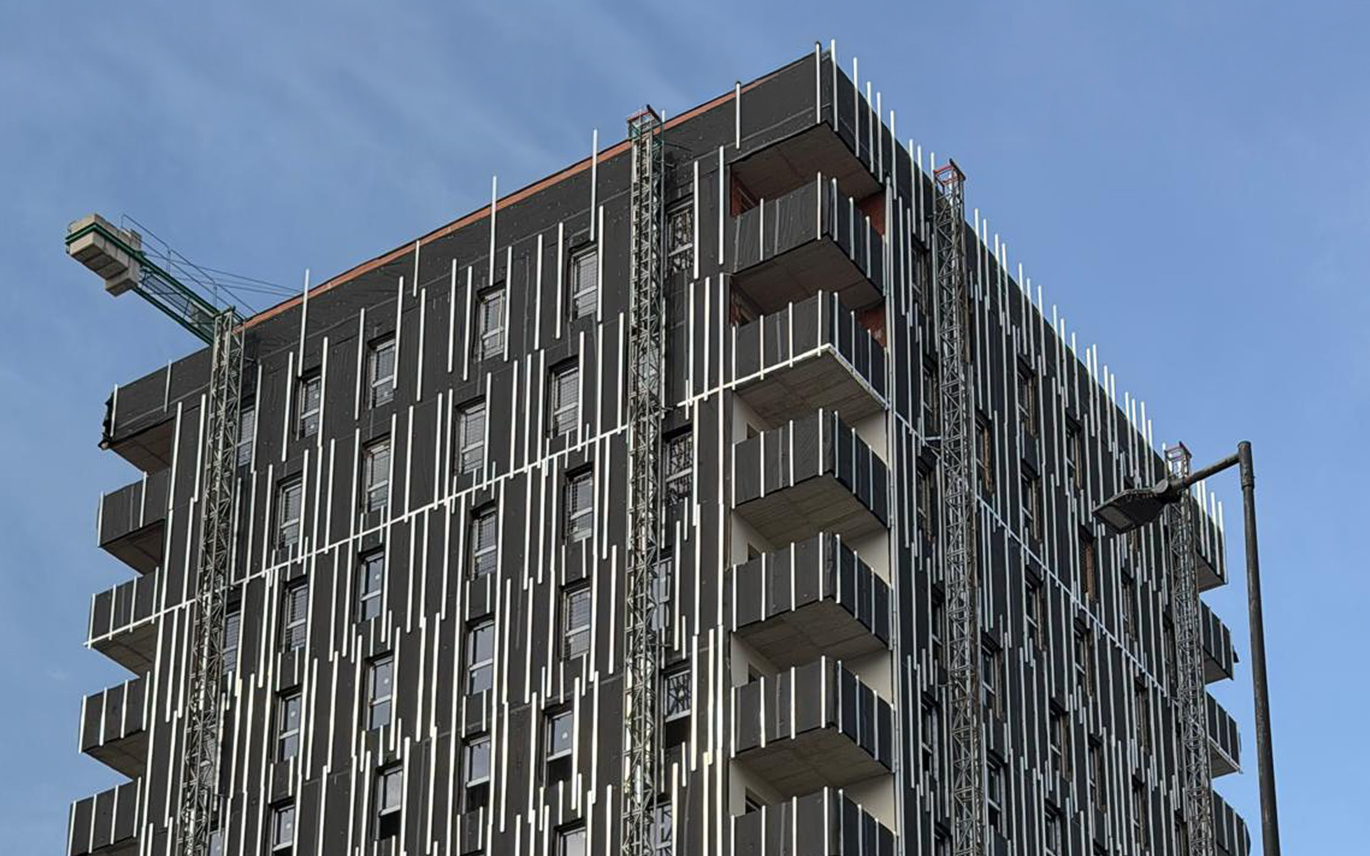 Completed ventilated façade protecting the building envelope of a multi-storey residential building